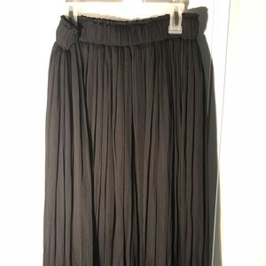 Toe length black satin skirt. Never worn.